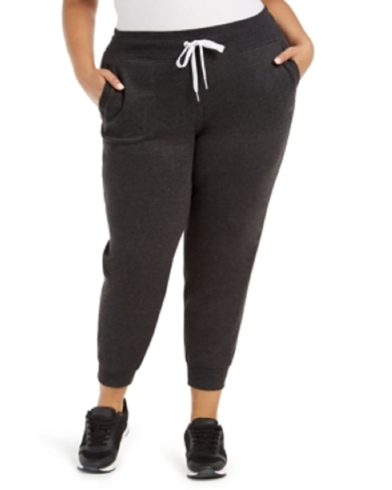 Front of a model wearing a size 3X Calvin Klein Performance Active Fleece Jogger Pants Blue 3X in Blue by Calvin Klein. | dia_product_style_image_id:305076